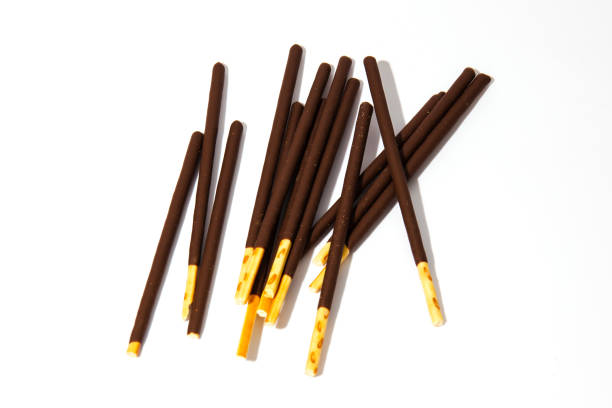 istock Pocky candy background.Box for cookies with bright flogging.Japan sweets. Bright white background 1143435032