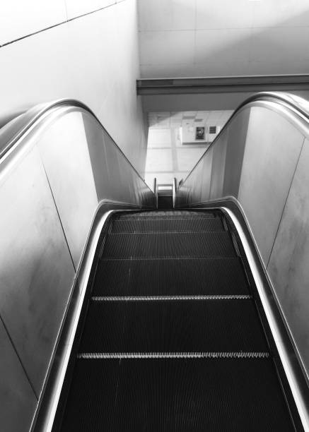 istock Escalator and staircase in subway station black and white 1143435282