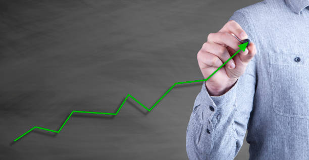 istock businessman draws an arrow, progress 1143436167