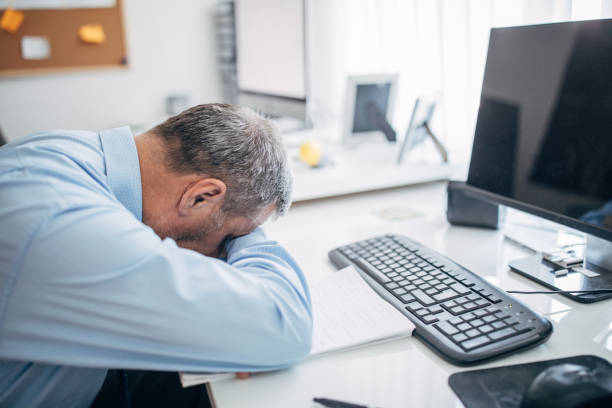 istock A tired businessman in the office 1143437863