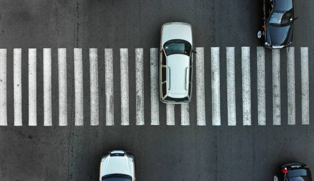 istock Car traffic through a pedestrian crossing. 1143438993