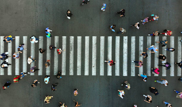 istock Aerial. Pedestrian crowd crossing. Top view. 1143439037