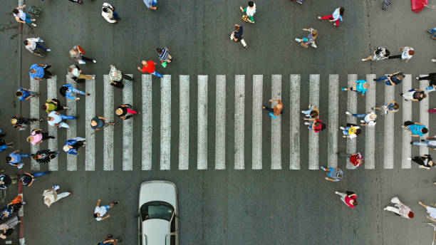 istock Aerial. Pedestrian crowd crossing crosswalk, top view. 1143439054