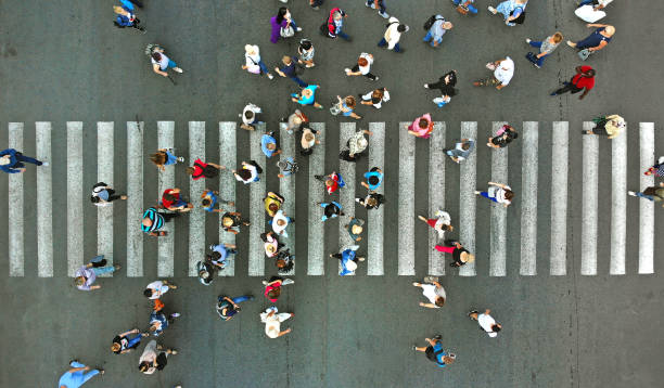 istock Aerial. People crowd and pedestrian crosswalk crossing. 1143439092