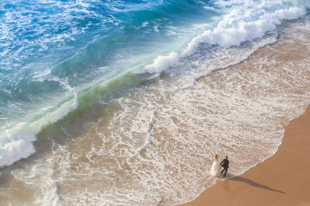 istock Beautiful wedding couple posing on beach 1143439484