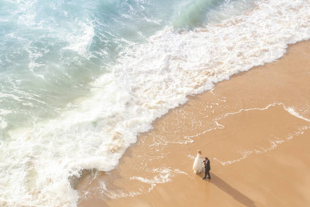 Beautiful wedding couple posing on beach