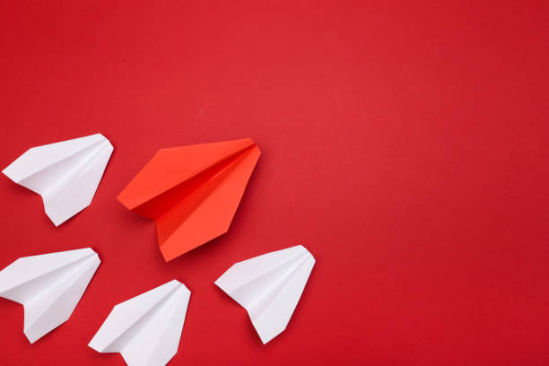 istock winner red  paper aircraft on red background - Image 1143441441