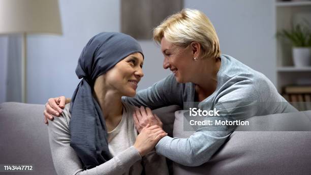Mom Supporting And Hugging Her Daughter With Cancer Visits In Oncohospital Stock Photo - Download Image Now