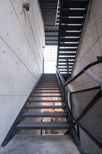 staircase with a steel handrail in a modern building stock photo