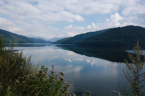 istock Panorama view including reflections on a mountain lake next to the Transfagarasan Highway, Romania 1143448360