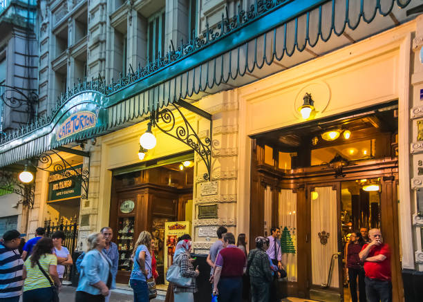 Everyday long queue outside Cafe Tortoni. This popular coffeehouse, Inaugurated in 1858, has been visited by many renowned politicians and celebrities Buenos Aires - Jan 2015: Everyday long queue outside Cafe Tortoni. This popular coffeehouse, Inaugurated in 1858, has been visited by many renowned politicians and celebrities bar drink establishment stock pictures, royalty-free photos & images