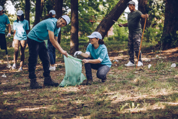 istock Busy volunteers cleaning park 1143450118