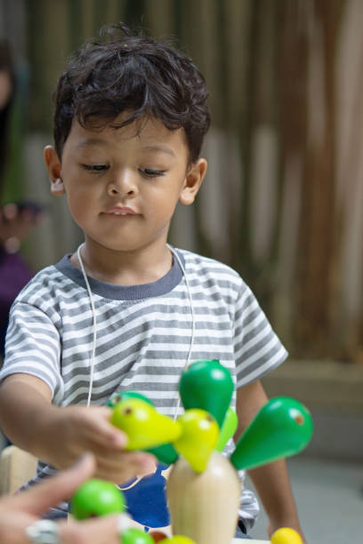 istock Cute Boy Playing With Toys 1143450705
