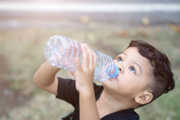 istock High Angle View Of Boy Drinking Water 1143450723