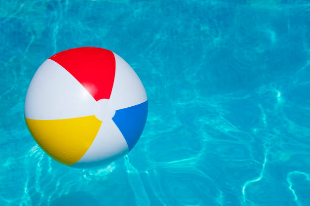 istock Colorful inflatable ball floating in swimming pool 1143451189