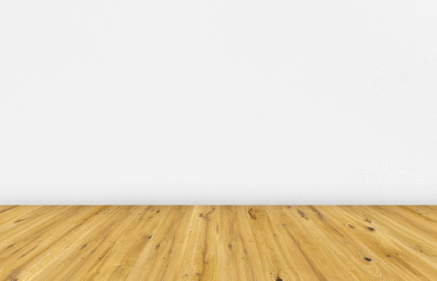 istock Empty room with brown wooden floor and white painted wall. Empty loft room for design interior. 1143452672