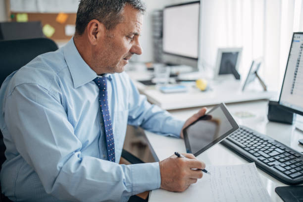 istock The businessman works in the office 1143455042