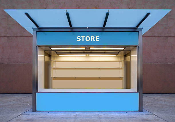 An empty store kiosk on the side of a road stock photo