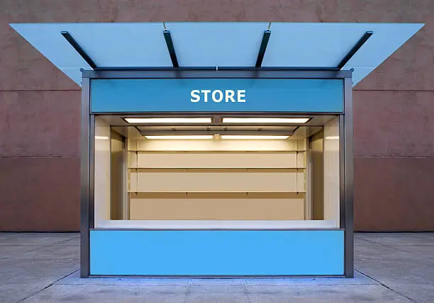 Photo of An empty store kiosk on the side of a road