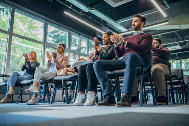 istock Millennial team applauding on board meeting 1143455722