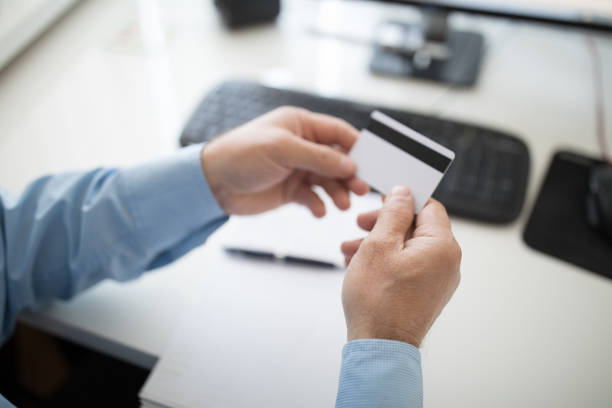 istock Hands hold a credit card 1143455858