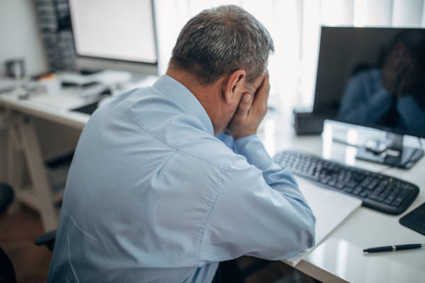 istock A tired businessman in the office 1143457655