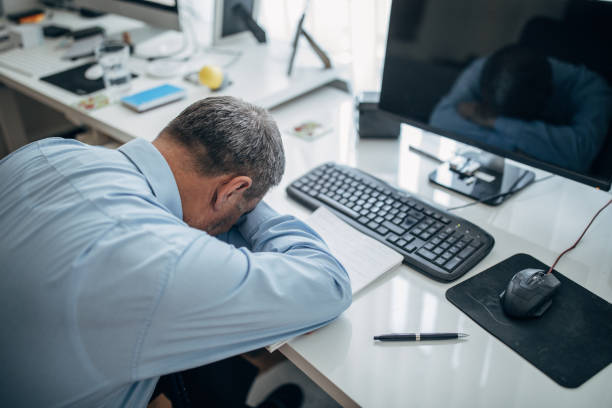 istock A tired businessman in the office 1143457657