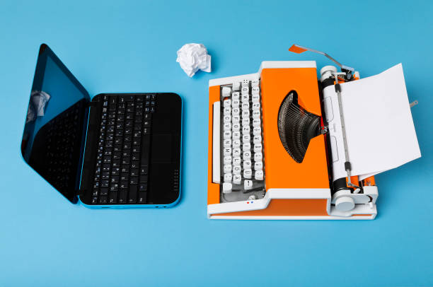 istock Digital and analog – Laptop and 70s Typewriter 1143460577