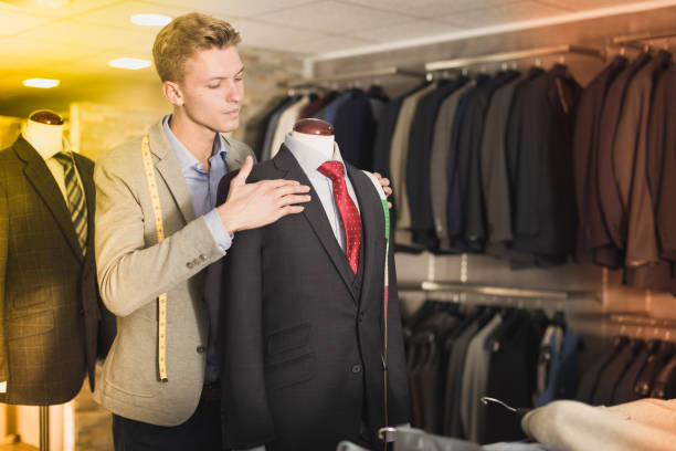 istock man seller measuring business style jacket 1143462139