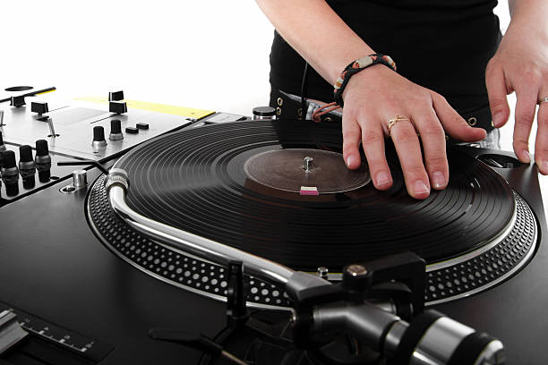 istock Female DJ scratching the vinyl record 114346223