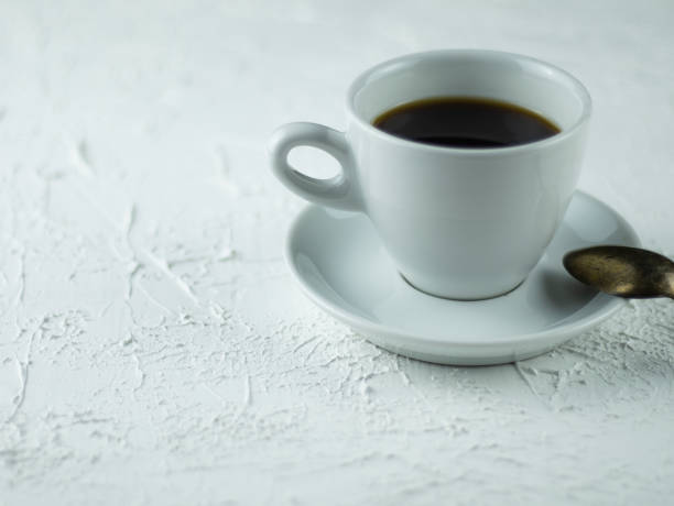 istock A cup of coffee on a light stone background 1143463132