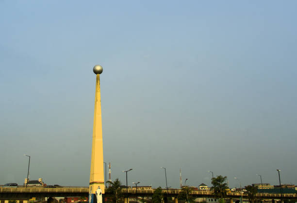 Lagos, Nigeria: concrete obelisk with globe - by the Third Axial Road, Abule Okuta / Oworosoki