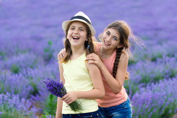 istock Two beautiful girls in lavender field 1143463550