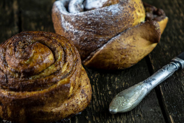 istock Sweet buns on a rough wooden background 1143463920
