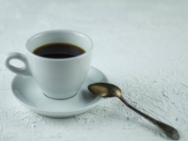 istock A cup of coffee on a light stone background 1143464610