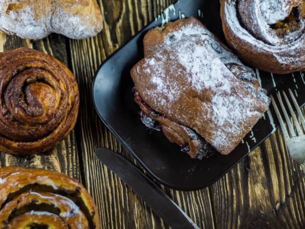 istock Sweet buns on a rough wooden background 1143464649