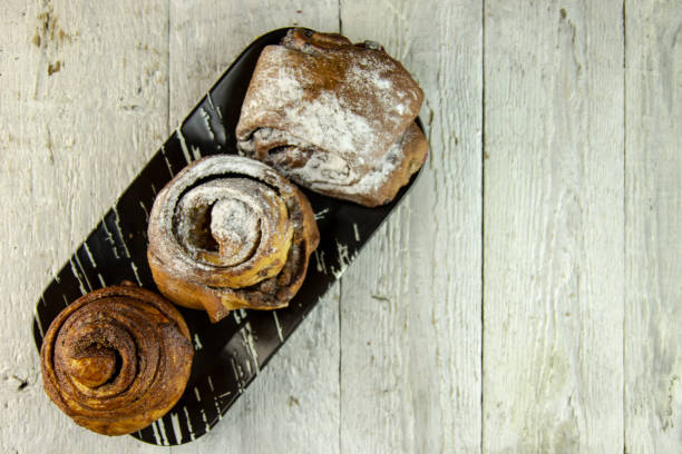 istock sweet buns on a rough wooden background 1143468088