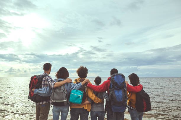 istock Making family hugs looking at the sea 1143469663