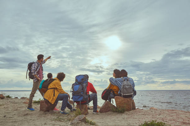 istock Friends gathering and looking at sea landscape 1143469676