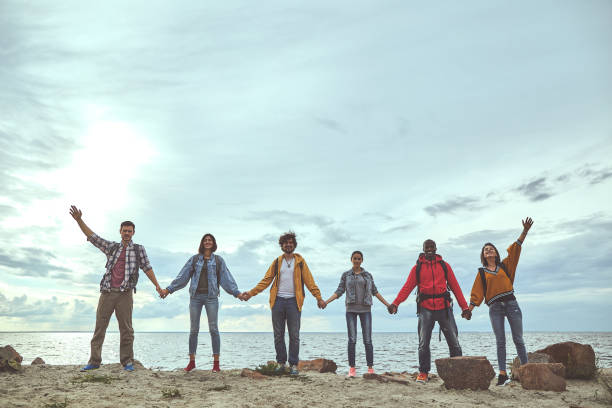 istock Team are happy gathering at the seaside 1143469684