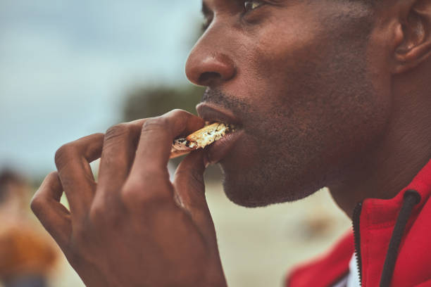 Adult man is holding crackers with chocolate
