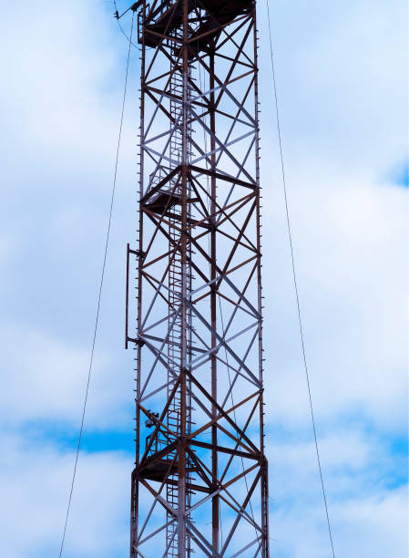 istock Vertical cellular towers with antennas background 1143469907