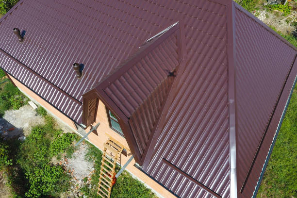 A view from above on the roof of the house. The roof of corrugated sheet. Roofing of metal profile wavy shape The roof of corrugated sheet. Roofing of metal profile wavy shape. A view from above on the roof of the house. gable stock pictures, royalty-free photos & images