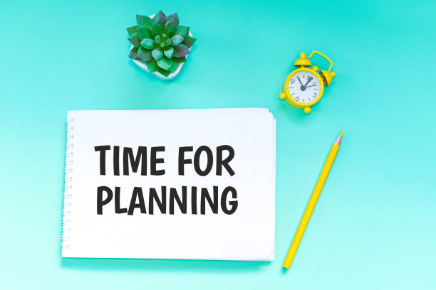 istock office Desk. the inscription in the notebook - time for planning 1143471761