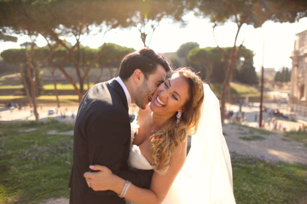 istock Beautiful wedding couple posing in garden 1143472837