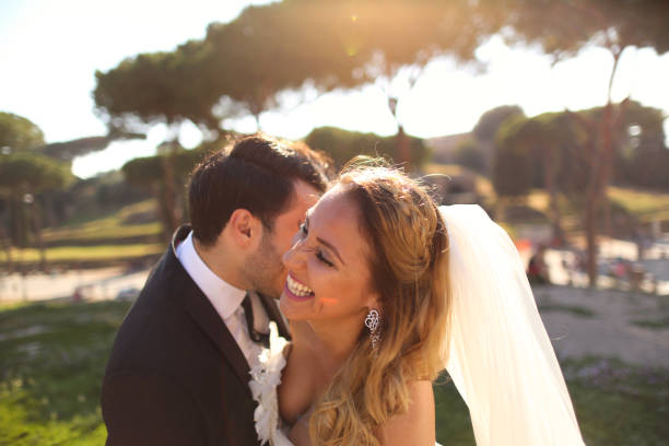 istock Beautiful wedding couple posing in garden 1143472881
