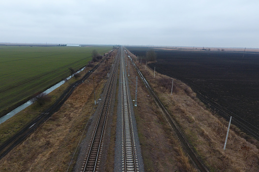 Plot railway. Top view on the rails. High-voltage power lines for electric trains.
