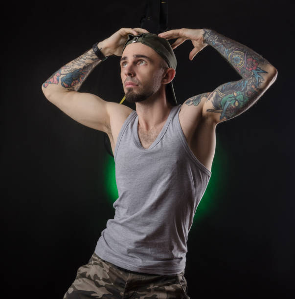 istock sports guy grimaces on the TRX simulator 1143481083