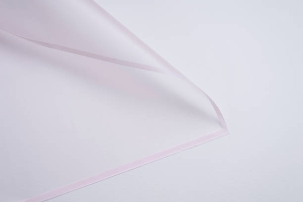 istock transparent paper corner with pink edges on white background 1143482237