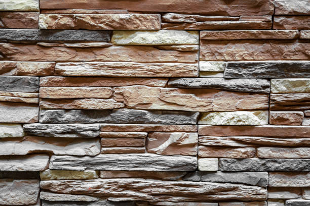 istock Background of brown stone wall made with blocks 1143484552